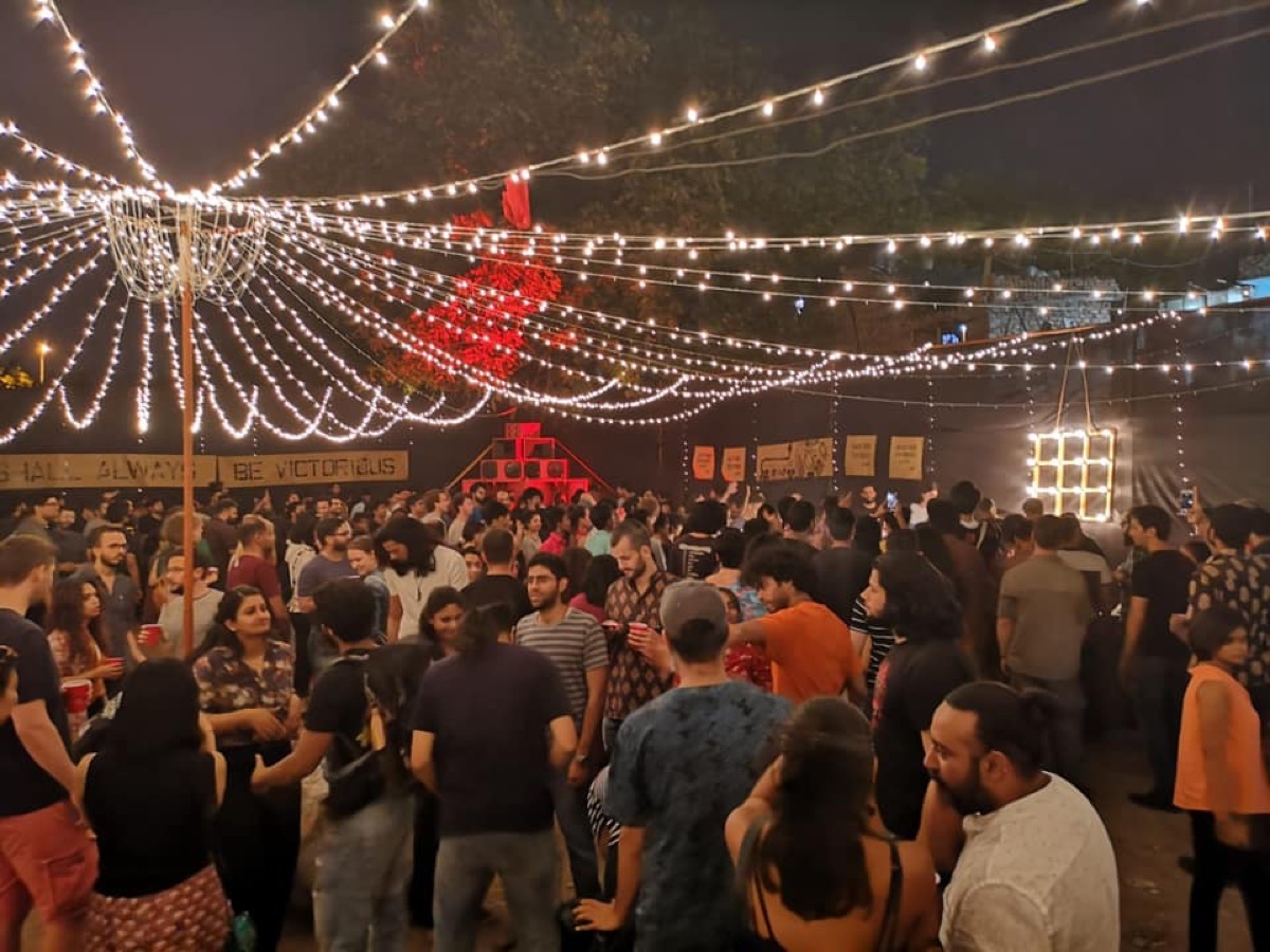 The BFR Sound System crowd dancing under strings of lights at night