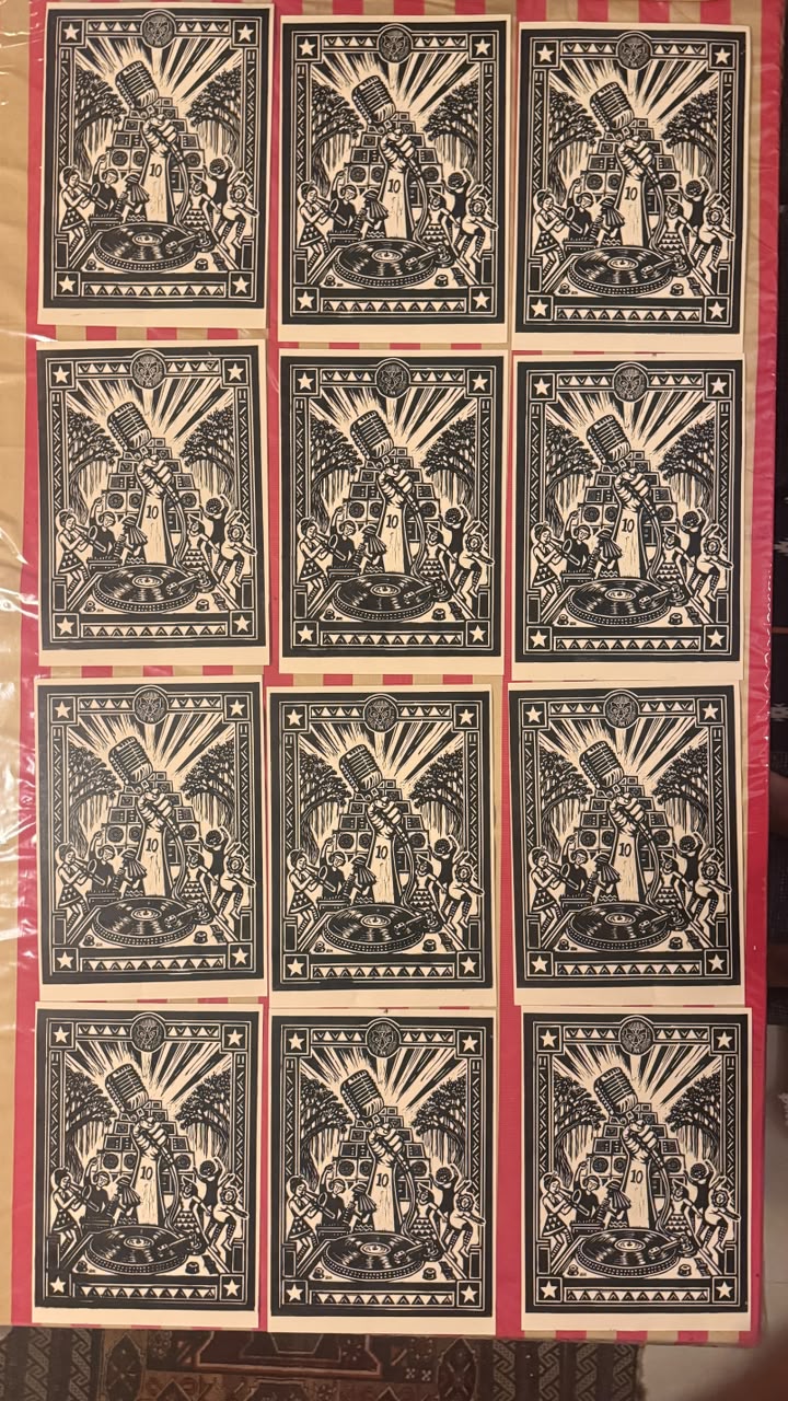 Numbered linocut prints of a fist raising a microphone over a sound system and turntable, marked 10 (3 of 3)
